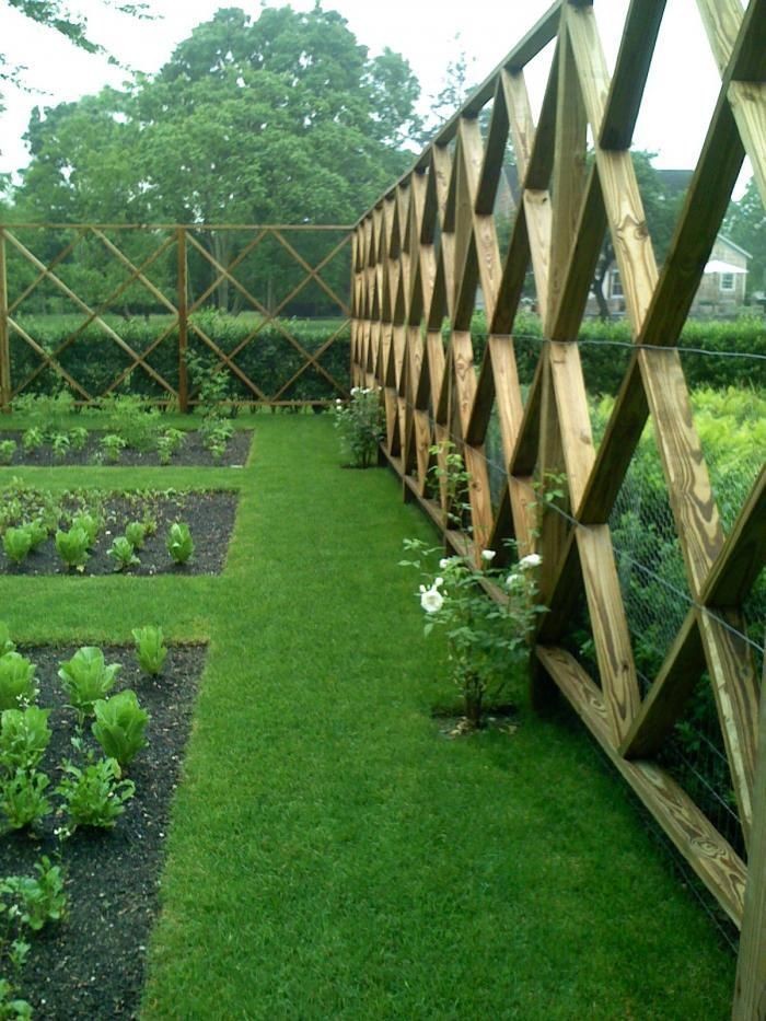 large latticed fence with a small wire backing